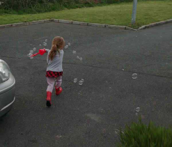 Granddaughter the Younger making bubbles